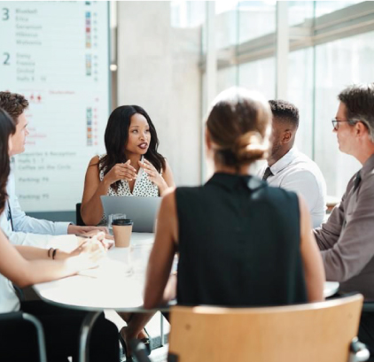 A group of people talking at a table