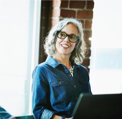 A woman in glasses and a denim top